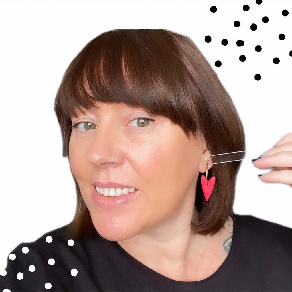 Try on picture of me wearing the red heart hoop earrings for size reference