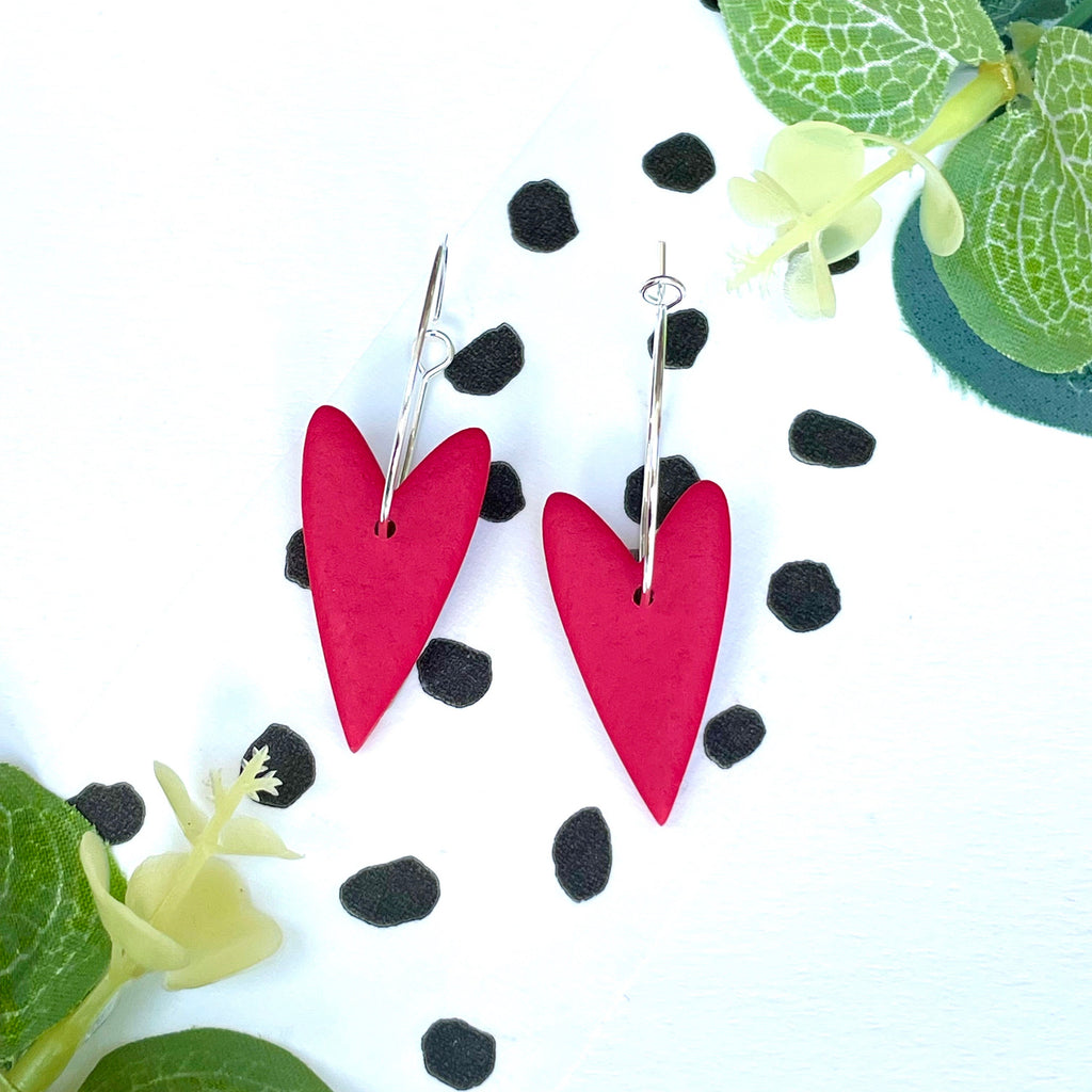 Bright red heart hoop earrings on a silver colour hoop
