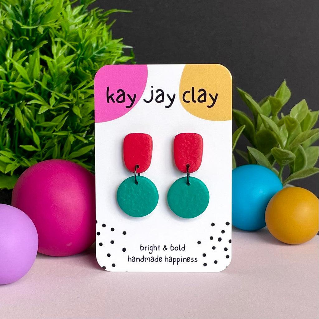 Red & Emerald Green colour pop dangle earrings on Kay Jay Clay branded mounting card