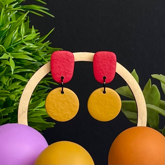 Red & Mustard Yellow colour pop dangle earrings on hoop display prop