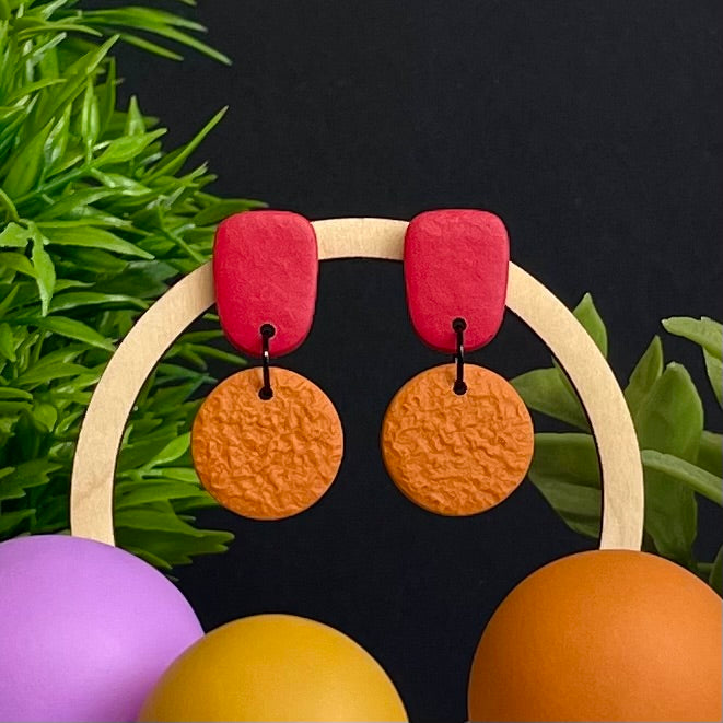Red & Orange colour pop dangle earrings on hoop display prop