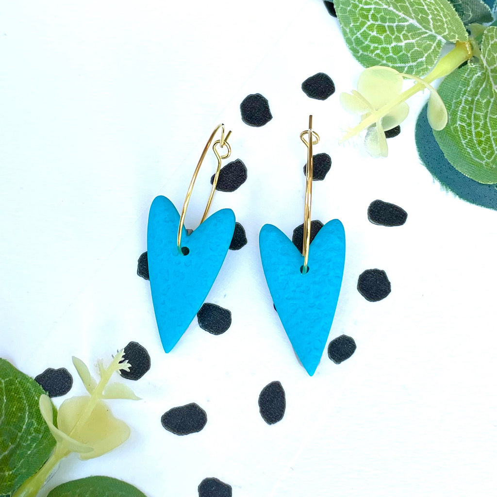 Turquoise blue heart earrings on a gold colour hoop