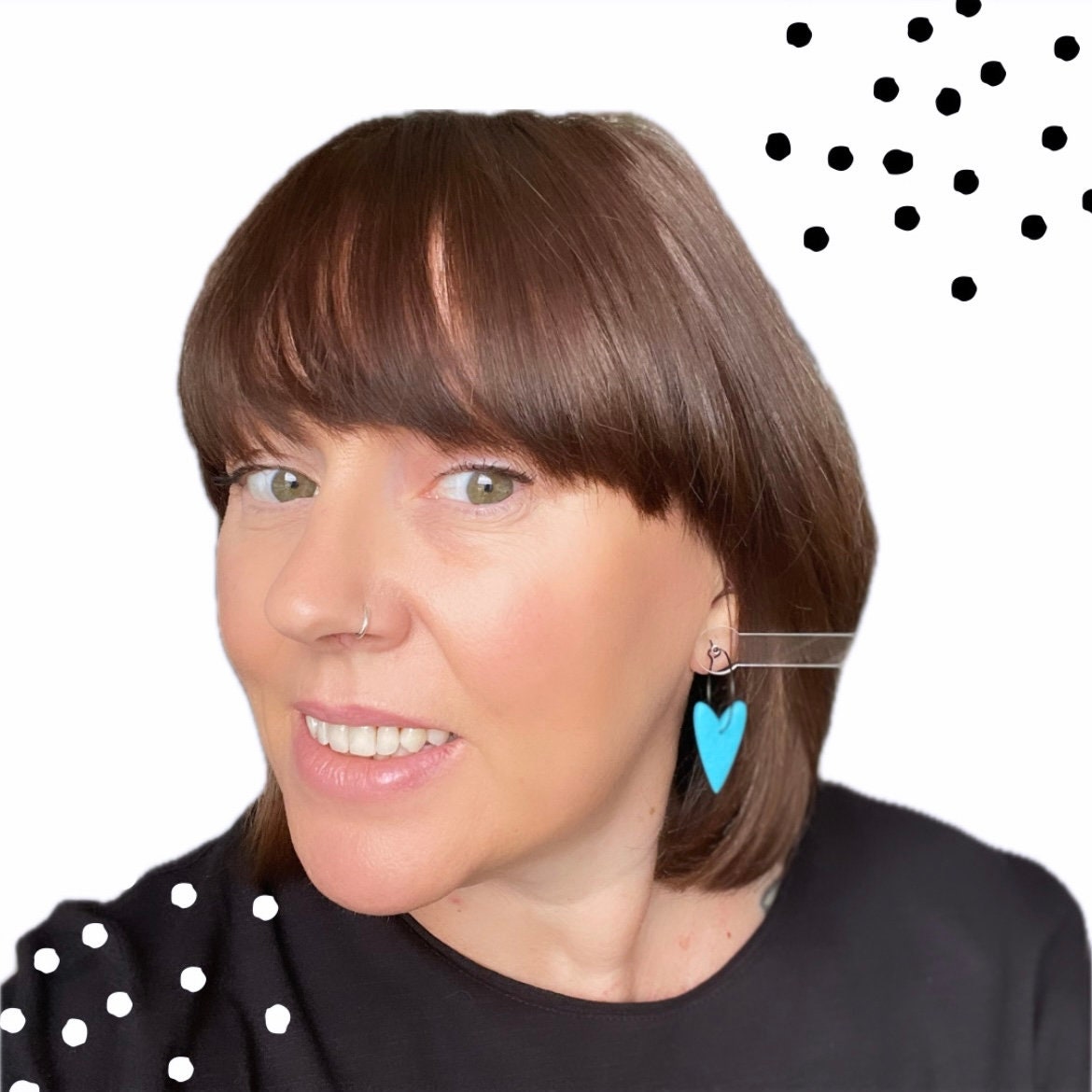 Try on picture of me wearing the turquoise heart hoop earrings for size reference