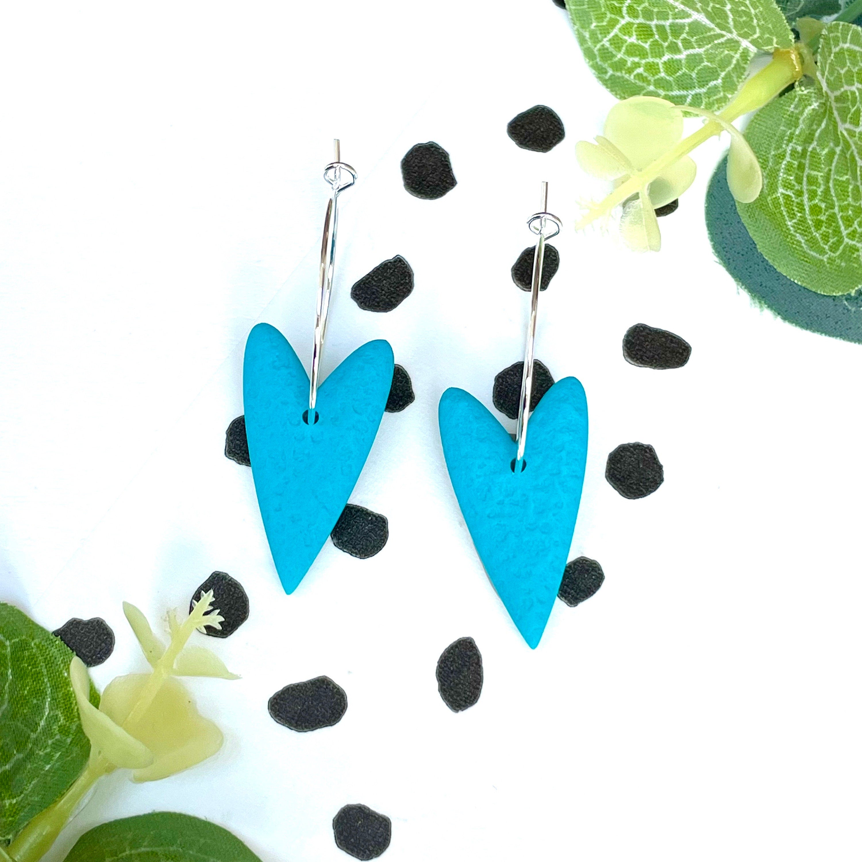 Turquoise blue heart earrings on a silver colour hoop