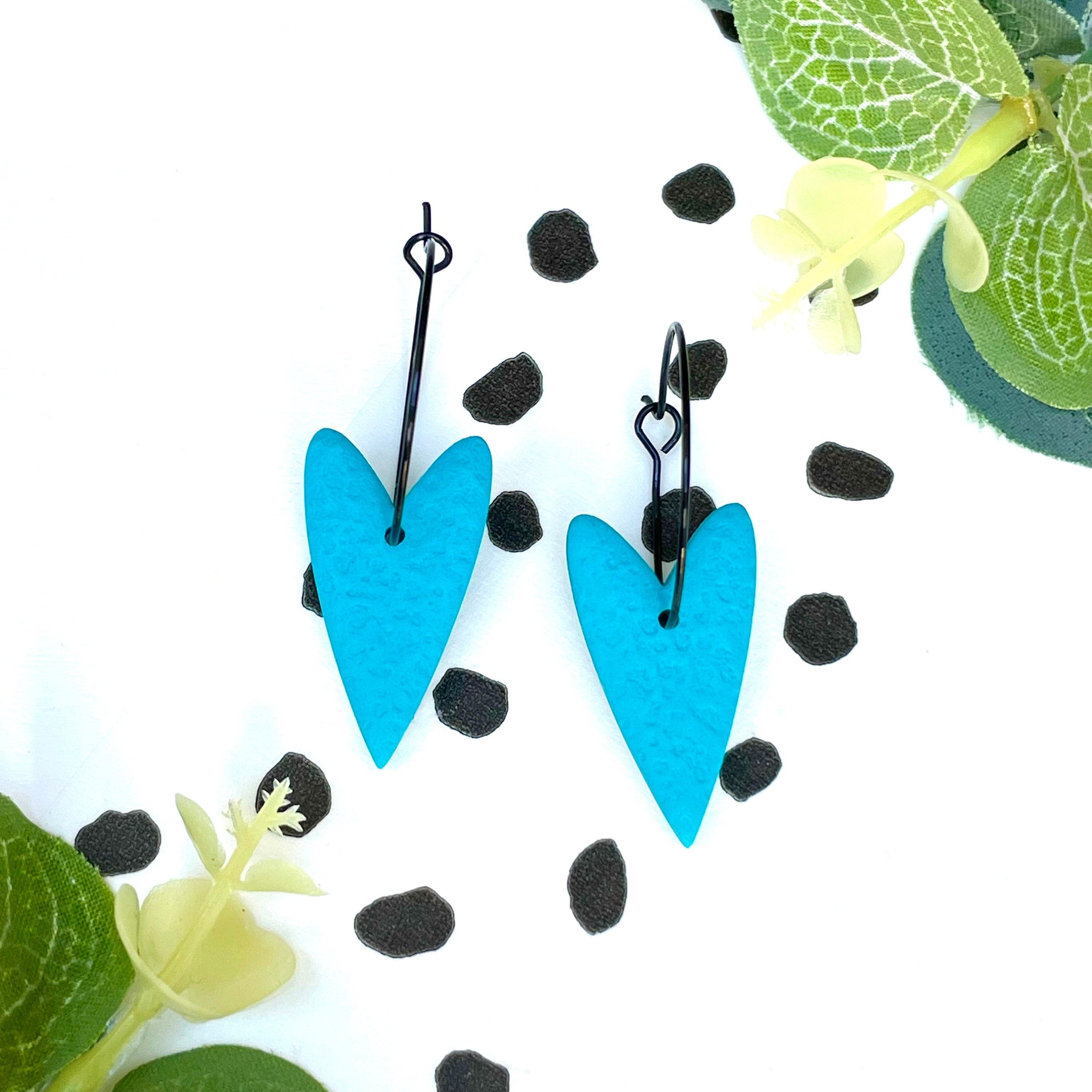 Turquoise blue heart earrings on a black colour hoop