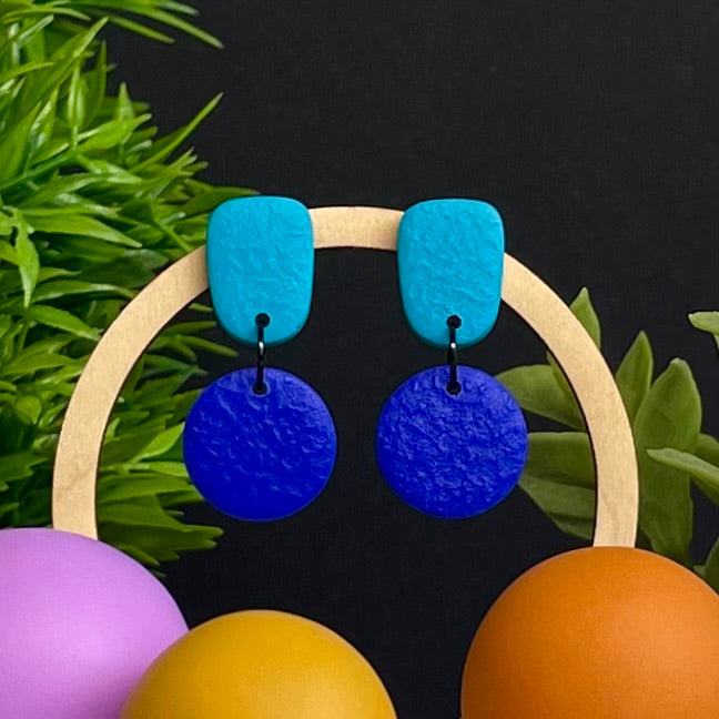 Turquoise & Electric Blue colour pop dangle earrings on hoop display prop