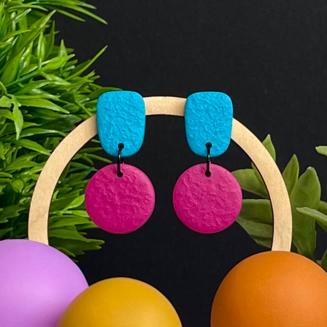 Turquoise & Hot Pink colour pop dangle earrings on hoop display prop