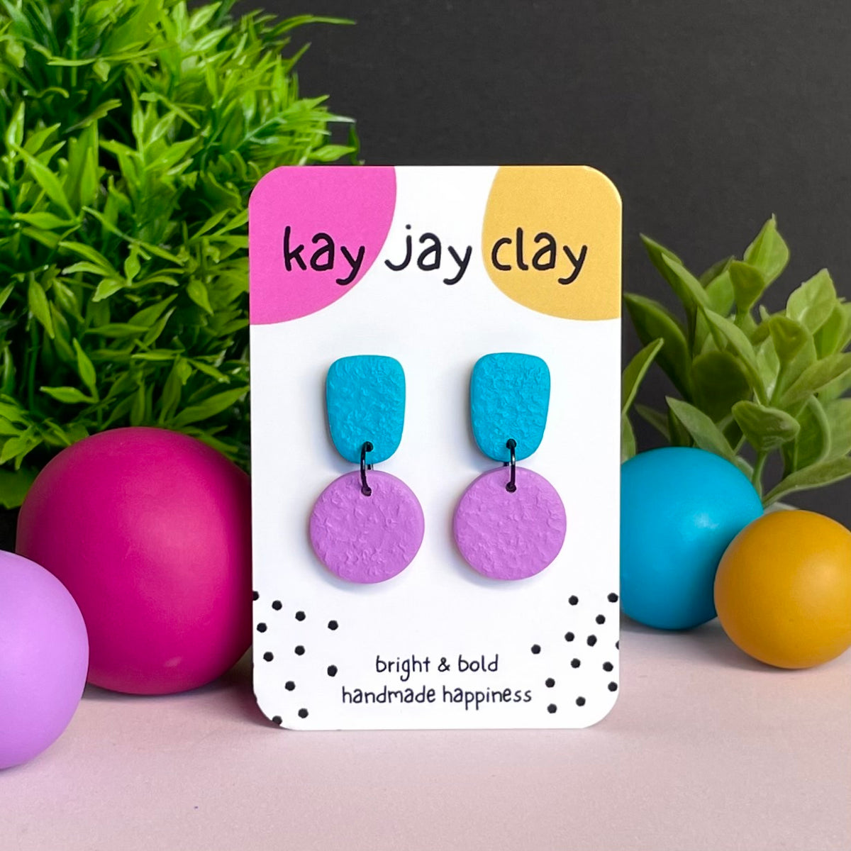 Turquoise & Lilac colour pop dangle earrings on Kay Jay Clay branded mounting card