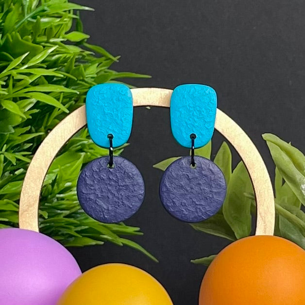 Turquoise & Navy Blue colour pop dangle earrings on hoop display prop