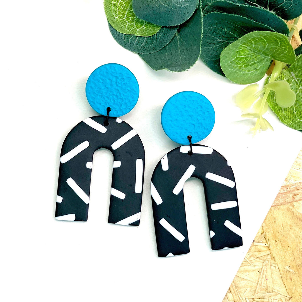 Turquoise and monochrome sprinkles arch dangle earrings