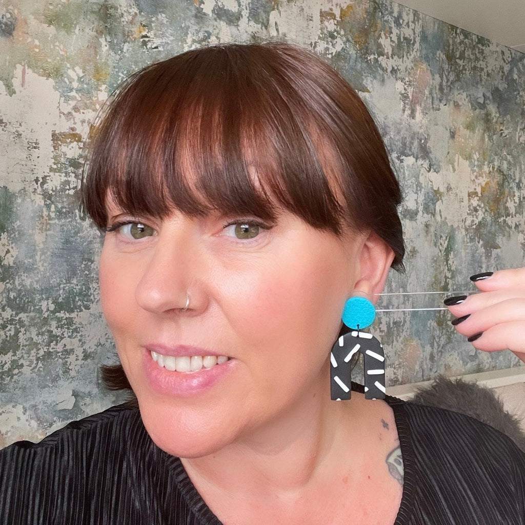 Try on picture of Kerry from Kay Jay Clay wearing the Turquoise and monochrome sprinkles arch dangle earrings