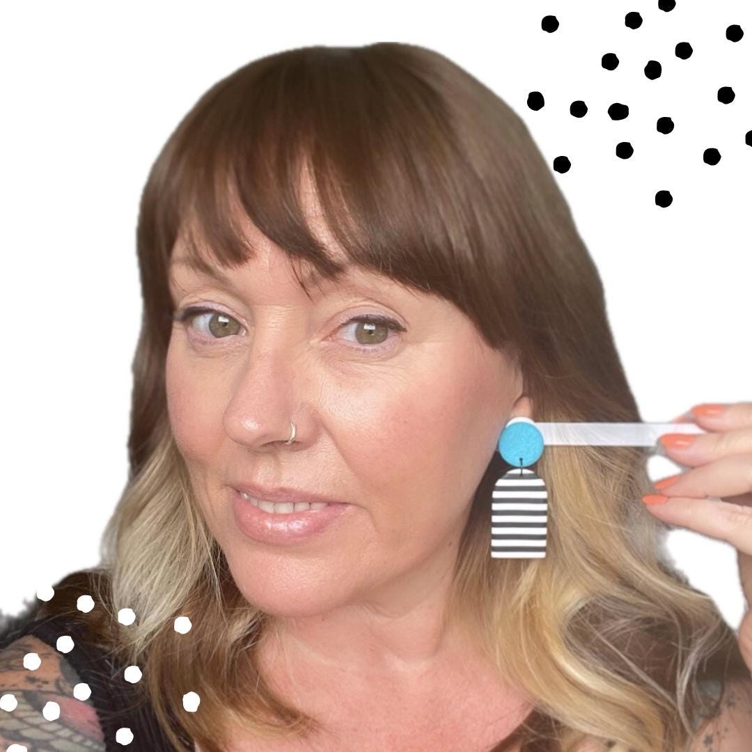 try on picture of Kerry from Kay Jay Clay wearing the turquoise mono stripe dangle earrings for size reference