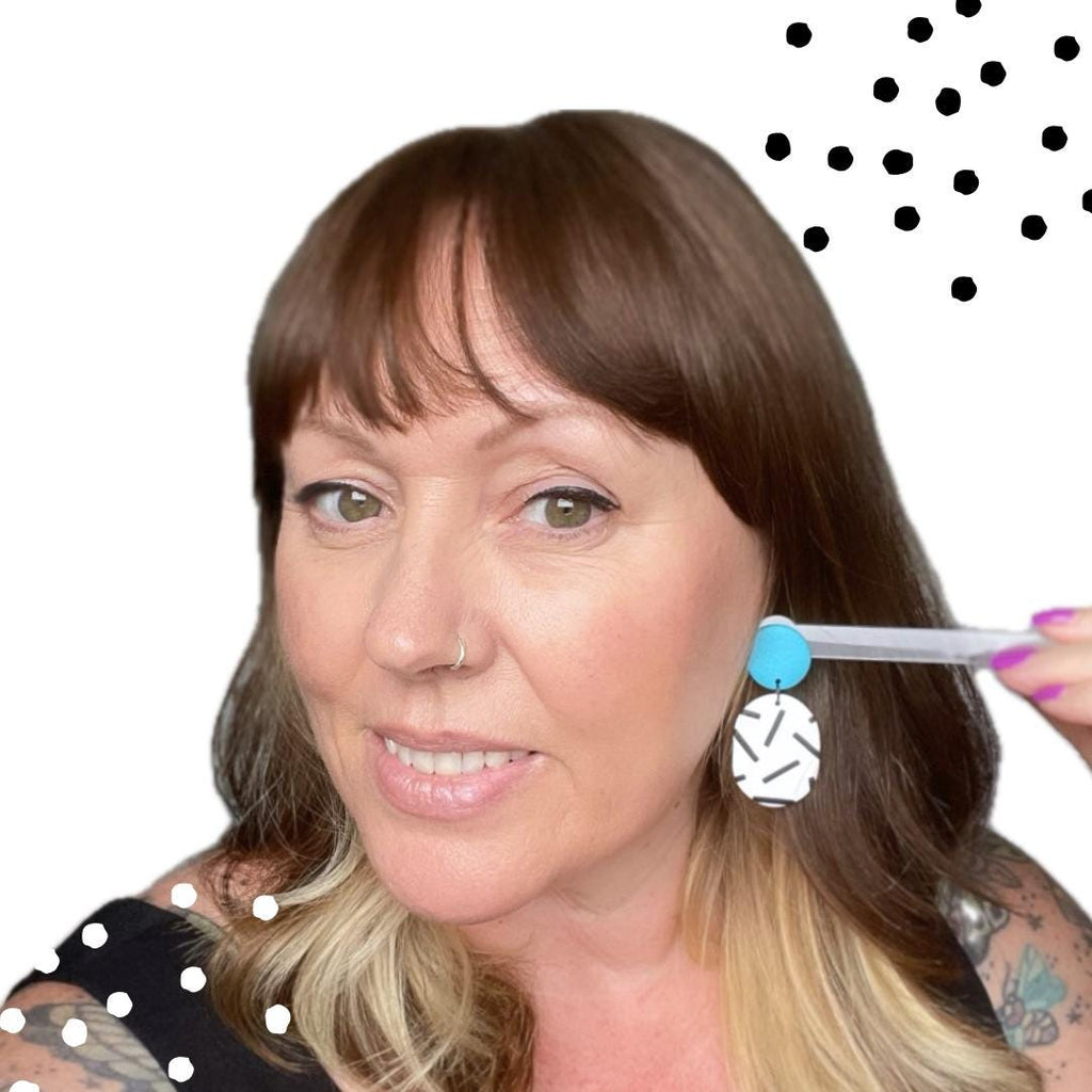 Try on picture of Kerry from Kay Jay Clay wearing the turquoise top mono sprinkle oval earrings for size reference