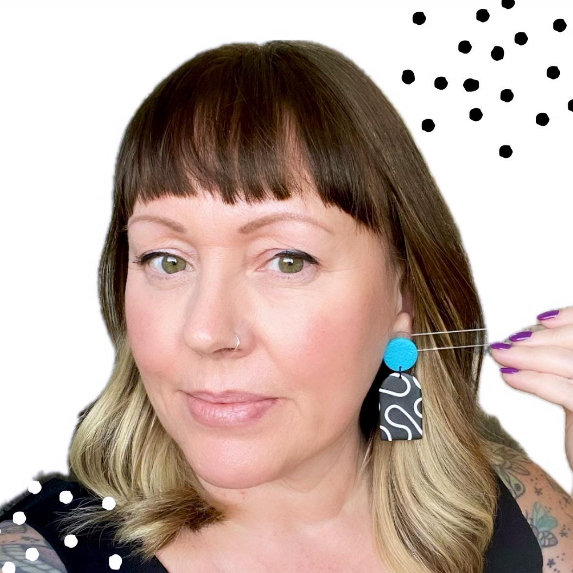 Try on picture of Kerry from Kay Jay Clay wearing the monochrome squiggle dangle earrings with turquoise top for size reference