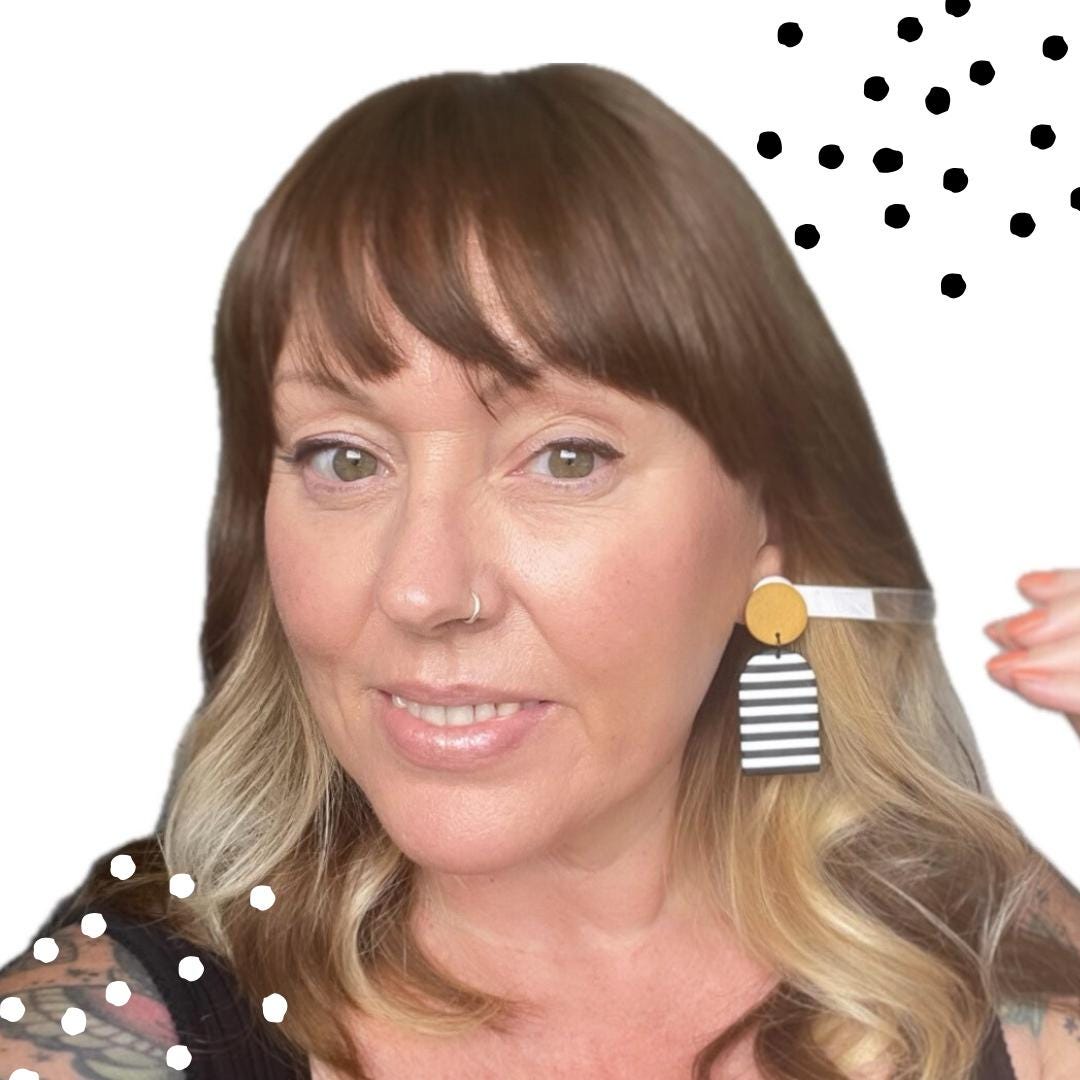 Try on pic with striped earrings demonstrating how they will look being worn 